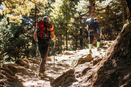 Man hiking on the way to mountain peak
