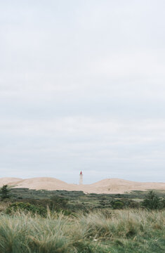 Lighthouse Rubjerg Knude and sand dunes at the danish North Sea coast, Denmark, Europe