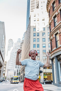 Retired Man Dancing in Streets with Roller Skates