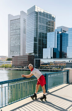 Senior Man on Using Cell Phone in the City