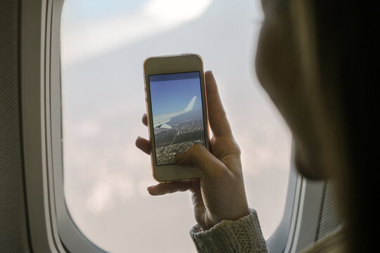 Woman Talking Picture From The Airplane