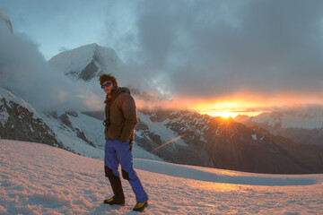 Alpinist standing up in beautiful mountain scenery