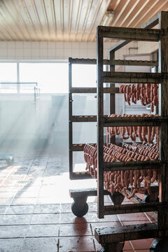 Rack with sausages hanging in a butcher shop