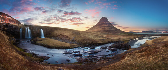 Scenic image of Iceland. Great view on famouse Mount Kirkjufell With Kirkjufell waterfall during sunset. Wonderful Nature landscape. Popular Travel destinations. Picture of wild area. 