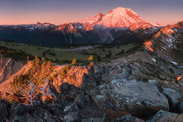 Mount Rainier towers over the surrounding mountains sitting at an elevation of 14,411 ft. It is considered to be one of the world's most dangerous volcanoes. Wonderful Nature landscape. Popular place