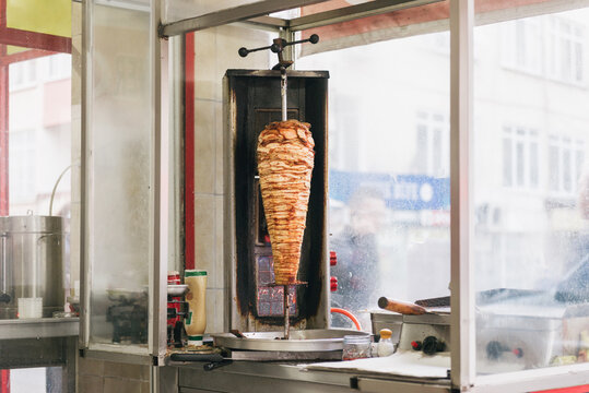 Preparation of shawarma on grill indoor