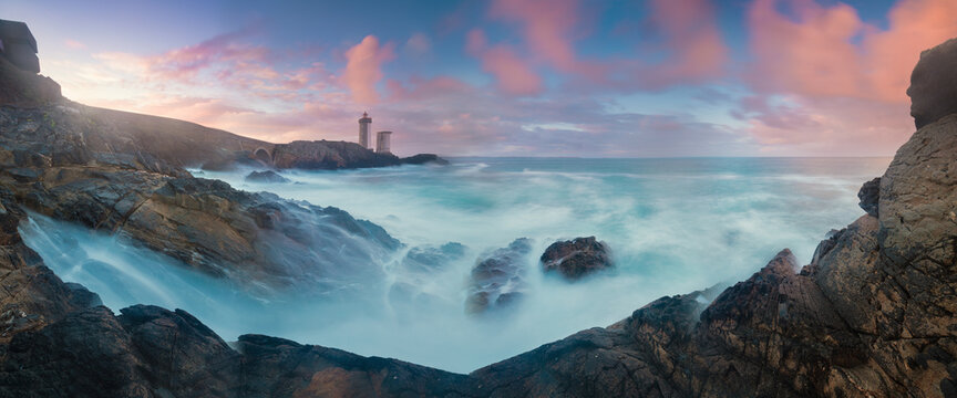Petit Minou Lighthouse at sunset with red light , Brest , France View of Lighthouse of Petit Minou in Brittany. Summer season in France coastline. Most popular lighthouse in Europe.