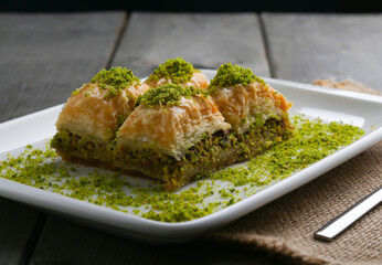 Baklava with pistachio on a white plate