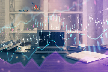 Financial graph colorful drawing and table with computer on background. Double exposure. Concept of international markets.