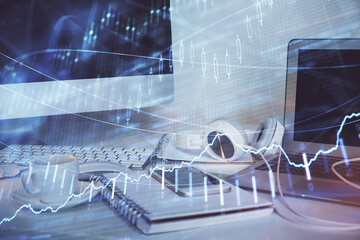 Stock market graph and table with computer background. Multi exposure. Concept of financial analysis.