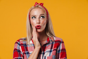 Image of surprised blonde pinup girl posing and looking upward