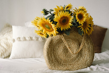 A bouquet of large sunflowers in wicker bag