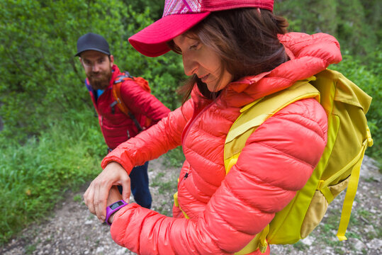 Caucasian female hiker checking her stopwatch
