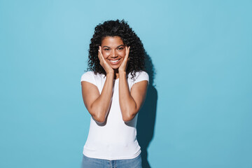 Image of happy african american girl smiling and looking at camera