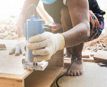 Guy Using A Router Craftsman Skillfully Using Handheld Router on Wooden Plank - Free Stock ...