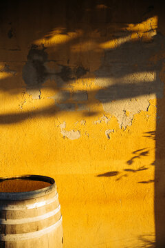 A barrel near aged wall