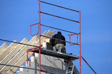 Carpenters working on a roof