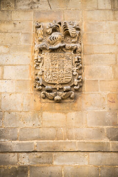 Coat of arms on a stone medieval facade