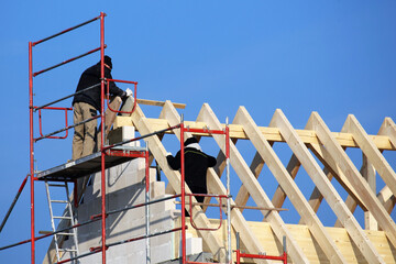 Carpenters working on a roof