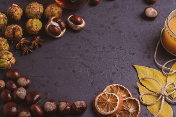 Obraz na płótnie Canvas autumn leaves on dark surface