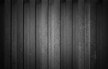Black and white aged vertical metal fence