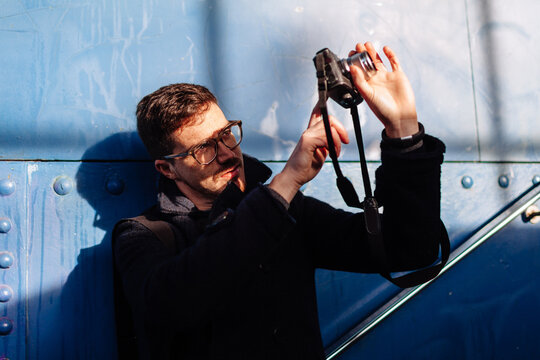 Man Take Picture with Mirrorless Camera
