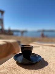 cup of coffee on the beach