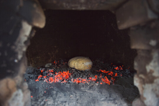 Bread getting baked in traditional stove