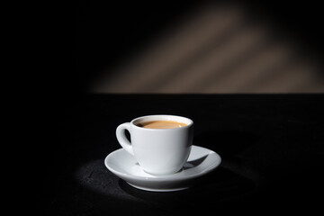 Cup of espresso on dark background