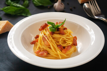 Carbonara paste on a dark background.