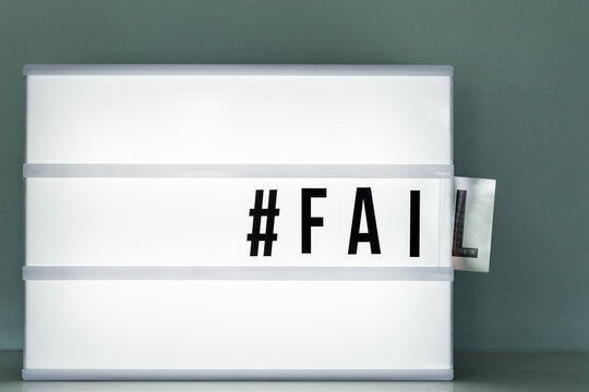 lightbox with the word fail falling out