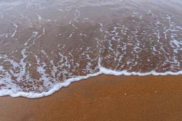 Sea ​​wave on the sand