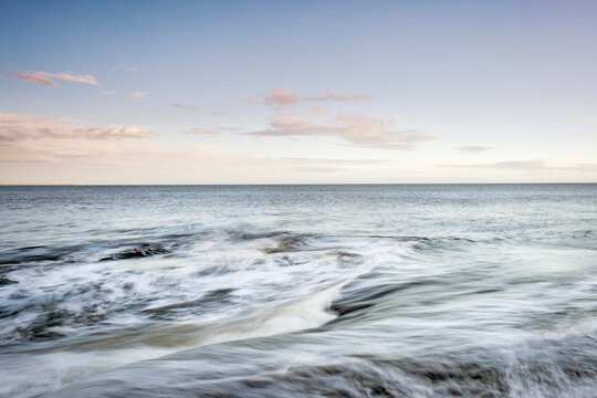 Swirling tides at dawn