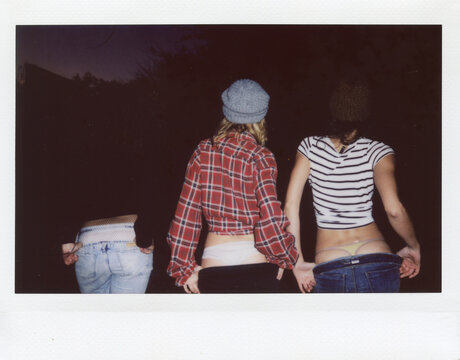 Girls showing their asses at night park.