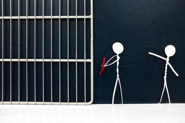 Stick figure victim pointing on a handcuffed suspect man tied with red rope going to a jail prison in dark background. Criminal apprehension, guilty, imprisonment and capture concept.