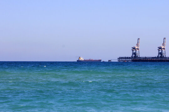 Dark blue sea in Zikim and boat