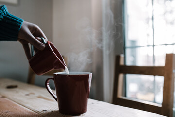 milk poured into hot tea