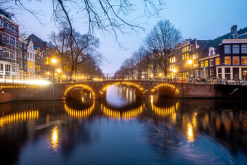Fototapeta na wymiar Beautiful bridges in the center of Amsterdam by night during winter , Netherlands