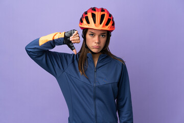 Teenager cyclist girl showing thumb down with negative expression