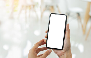 cell phone mockup blank white screen.woman hand holding texting using mobile on desk at coffee shop.background empty space for advertise.work people contact marketing business,technology