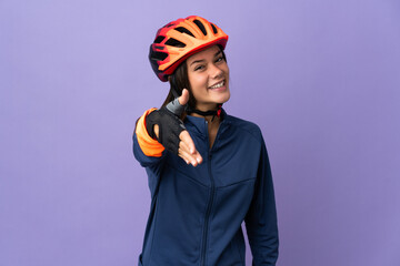 Teenager cyclist girl shaking hands for closing a good deal