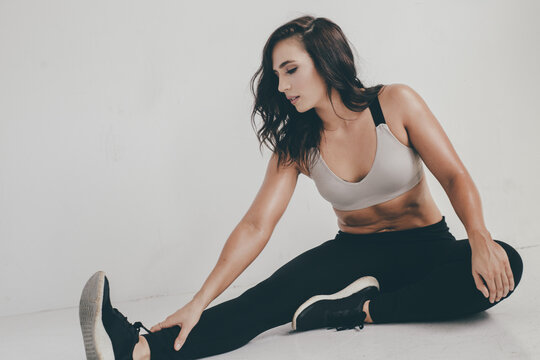 Young beautiful woman in fitness wear