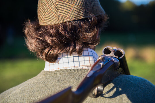 Hunter walking with his shotgun open