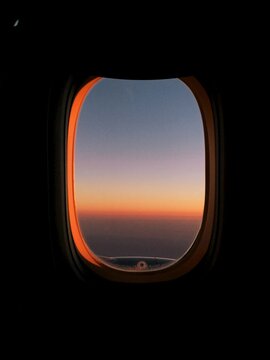Airplane Window Seat View of Sunset overlooking Doha, Qatar.