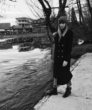 Woman walking by the beautiful river Una in Bihac