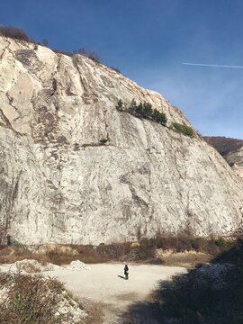 Litte woman in the mountains