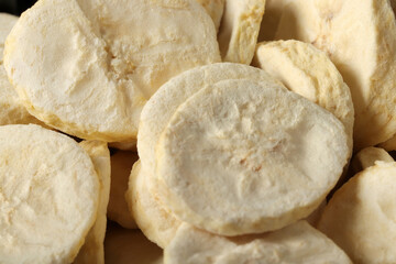 Pile of sweet dehydrated banana slices.