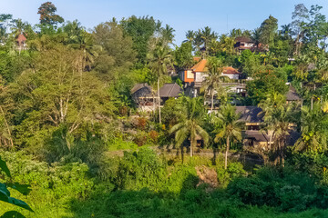 Sunset view on jungle and villas at Ubud, Bali, Indonesia