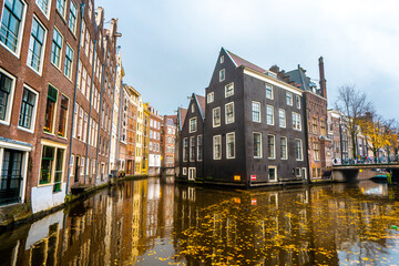 Fototapeta na wymiar Beautiful building and canals near Red light and Damrak street in Amsterdam , Netherlands