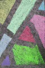 colorful geometric chalk drawing on an asphalt  